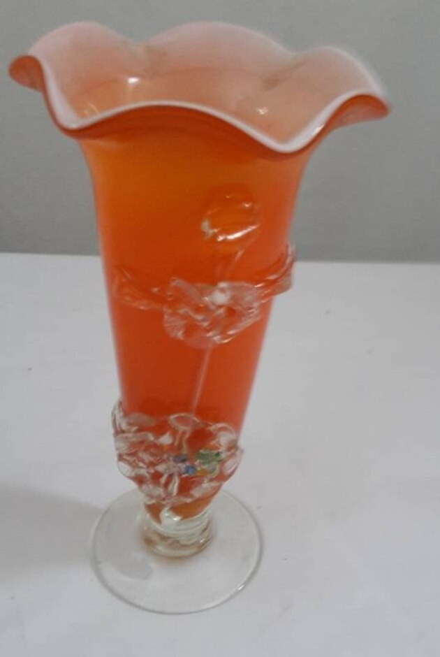 Orange And Clear Glass Vase Decorated With Glass Flowers Around Base