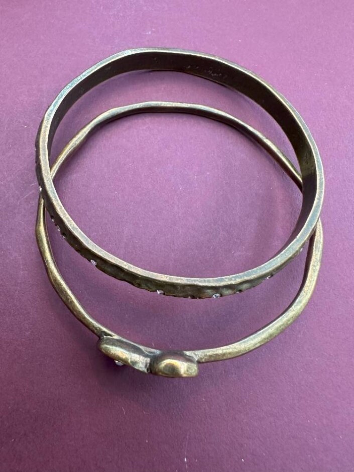 Two Hammered Metal Bangles With Glass Detail